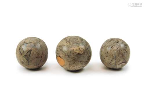 Three Fossil Conglomerate Spheres