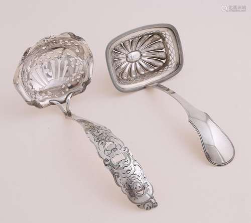 Two silver spreaders