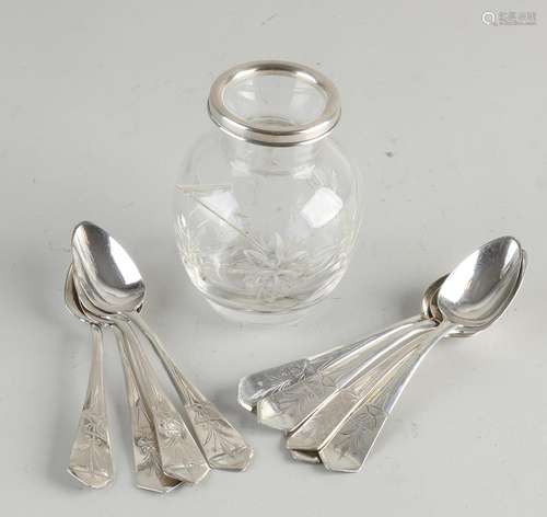 Spoon vase with silver spoons