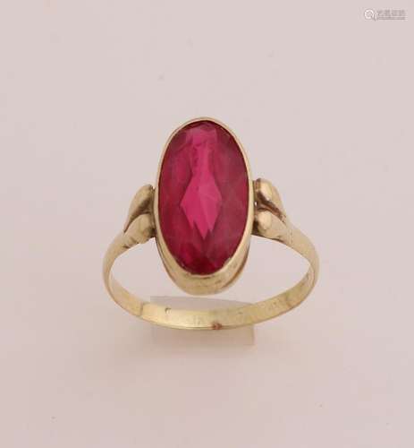 Gold ring with red stone