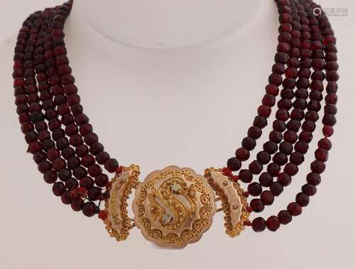 Garnet necklace with gold regional brooch