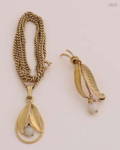 Gold necklace with pendant and brooch