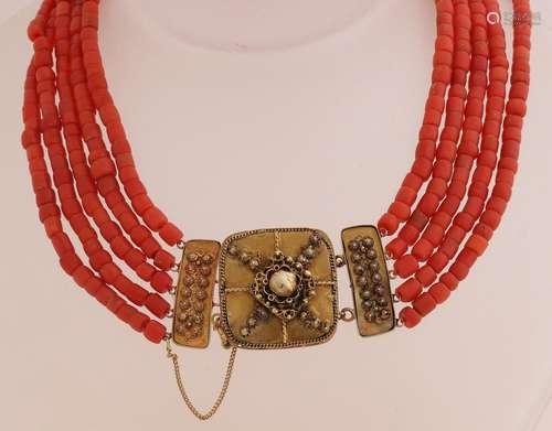 Blood coral necklace with gold clasp.