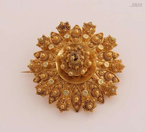 Gold regional brooch