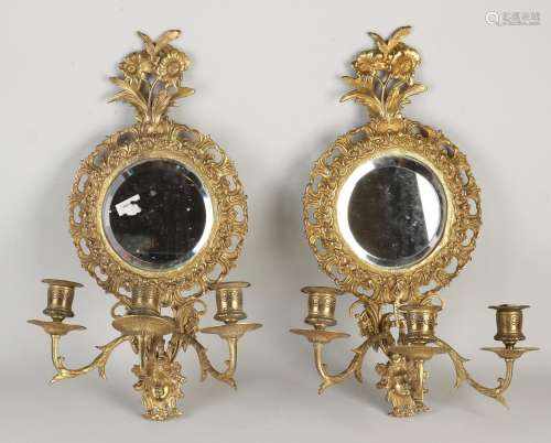 Two gold-plated wall sconces with mirror