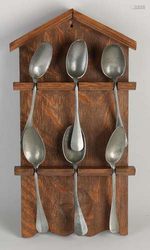 Spoon rack with tin spoons