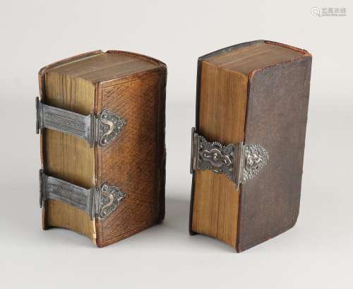 Two bibles with silverware
