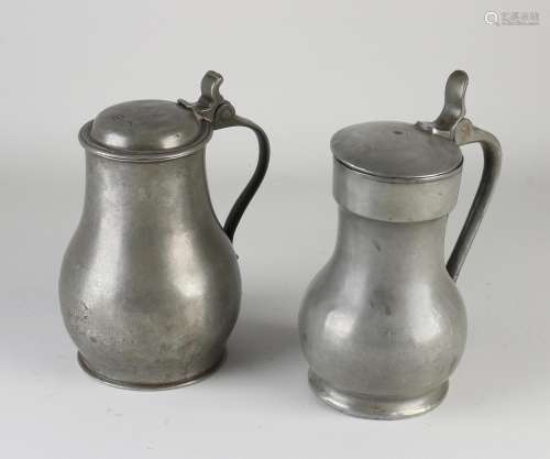 Two tin valve jugs
