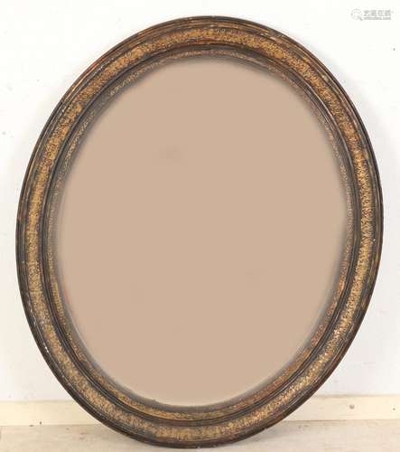 Oval mirror, 77 x 88 cm.