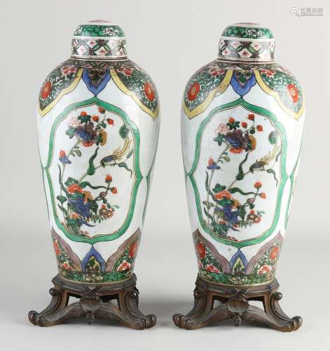 Pair of 18th century Chinese lidded vases, H 30.5 cm.