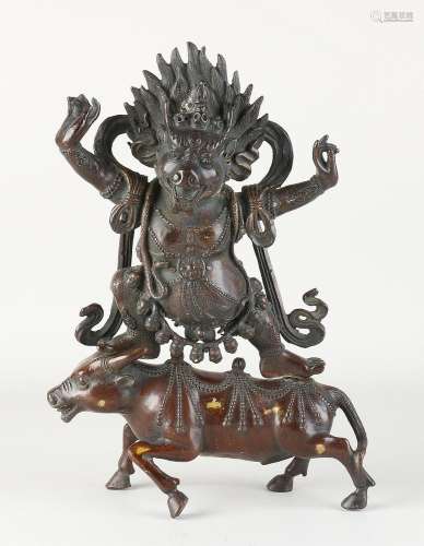 Ancient Chinese bronze Buddha figure on water buffalo