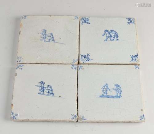 Four antique wall tiles