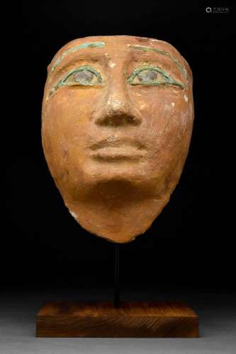 AN EGYPTIAN GESSO-PAINTED WOOD MUMMY MASK