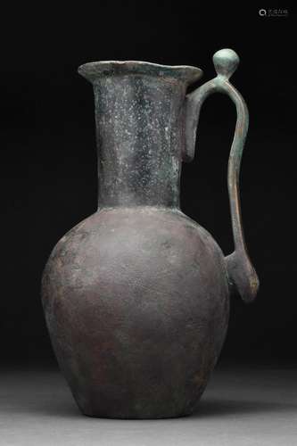 LATE SASSANIAN OR EARLY ISLAMIC BRONZE EWER WITH PROTRUDING ...