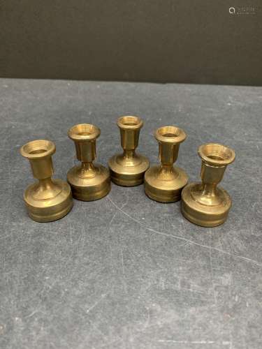 Lot of five vintage brass candle stick holders or paper weig...