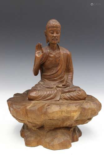 Chinese carved wood figure of a Buddha.