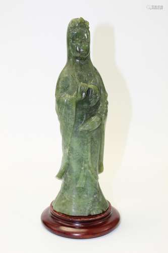 Carved Chinese spinach jade Guanyin statue.