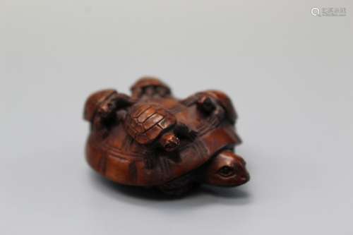 Turtles, Japanese wood carving, maker's mark on the bot...