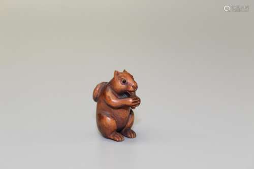 Squirrel, Japanese wood carving, maker's mark on the bo...