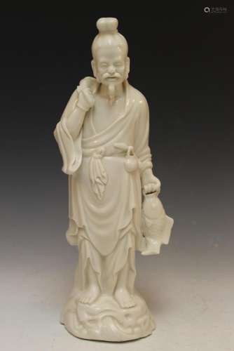 Chinese blanc de chine porcelain figure of a fisherman.