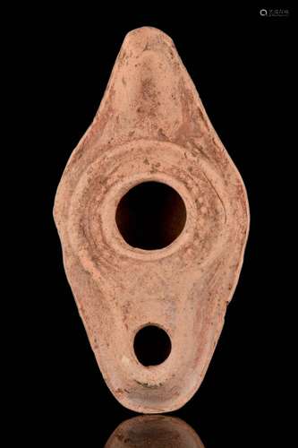 A ROMAN POTTERY OIL LAMP