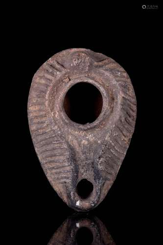 A ROMAN POTTERY OIL LAMP