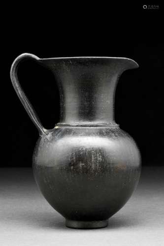 AN ETRUSCAN BUCCHERO WARE JUG