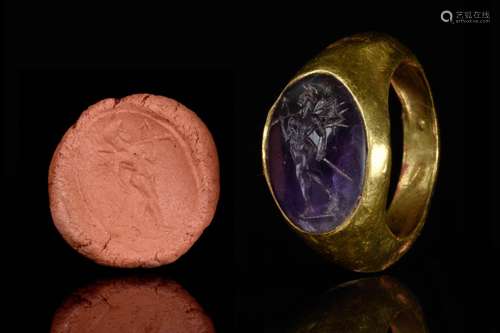 A ROMAN GOLD RING WITH AMETHYST INTAGLIO DEPICTING CUPID