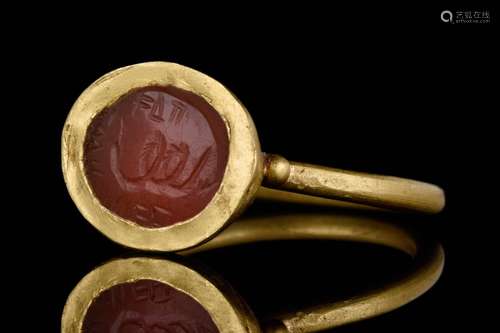 A ROMAN GOLD AND CARNELIAN INTAGLIO DEPICTING AESCULPIUS