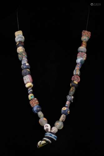 A PHOENICIAN GLASS BEADS