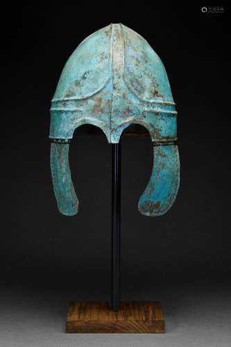 A GREEK CHALCIDIAN BRONZE HELMET