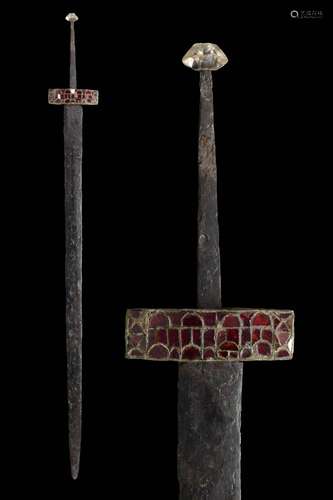 A MEROVINGIAN IRON SPATHA SWORD WITH ALMANDINE GARNET AND RO...