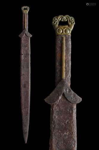 A SCYTHIAN ACINACES IRON SWORD WITH GRIFFIN HANDLE