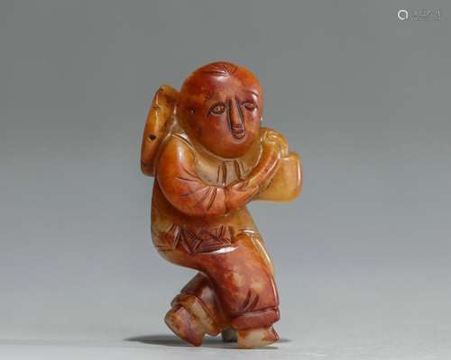 A carved jade kid