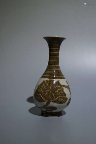 An incised pottery vase
