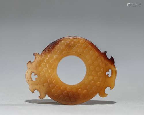 A carved jade bi