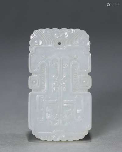 A carved jade dragon pendant