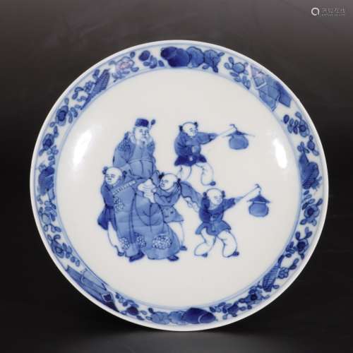 A blue and white figural plate