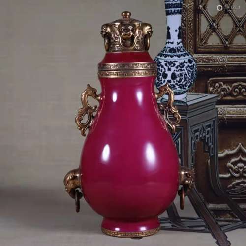 A red glaze vase with cover
