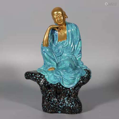 A green glaze and gilt bodhisattva