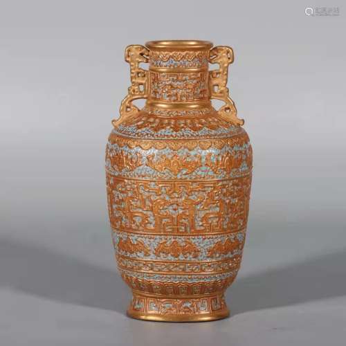 A porcelain and gilt vase