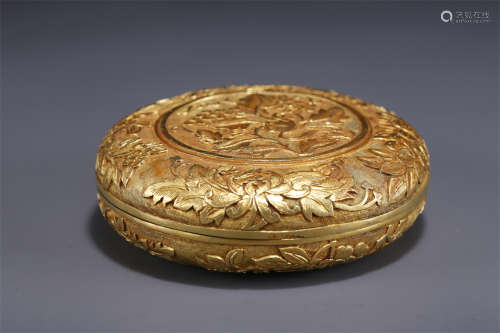 A Gilt Copper Lidded Box with Flowers Design.