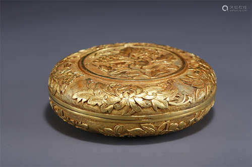 A Gilt Copper Lidded Box with Flowers Design.