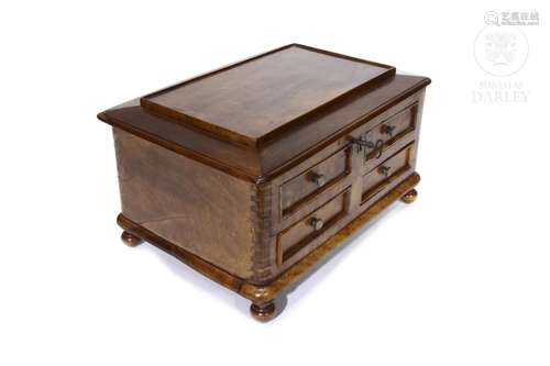 Wooden jewelry box with drawers.