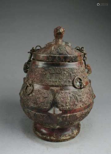 A Bronze Jar With Lid