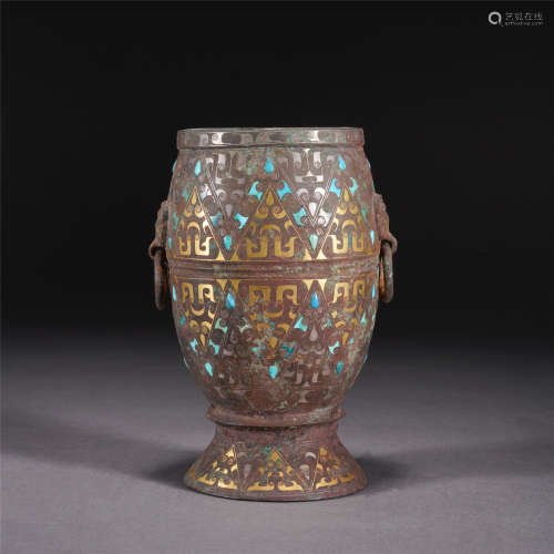 A BRONZE PAINTED GOLD AND SILVER CUP