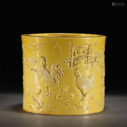 A YELLOW GLAZED CARVED PORCELAIN BRUSH POT