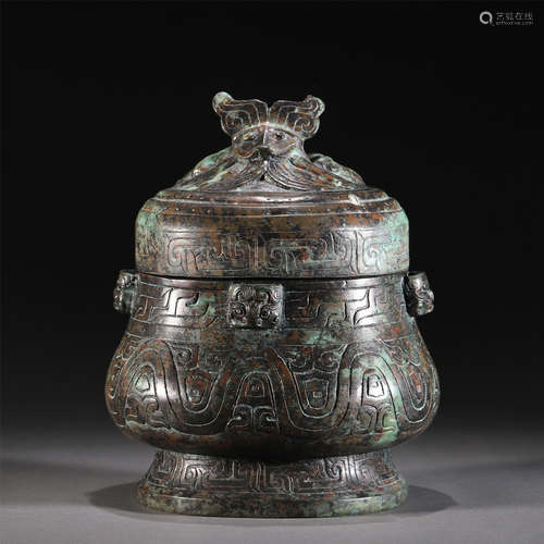 A BRONZE ROUND LIDDED VASE