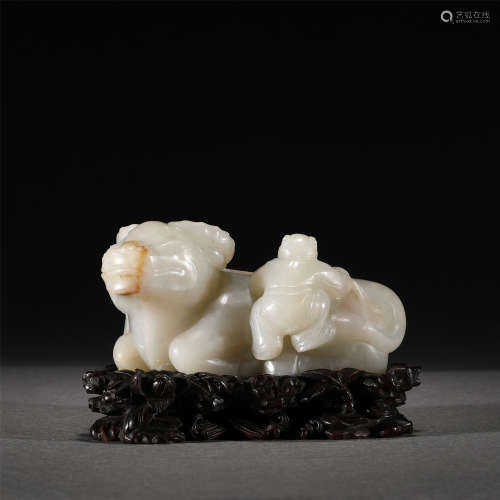 A WHITE JADE CARVED BOY AND CATTLE