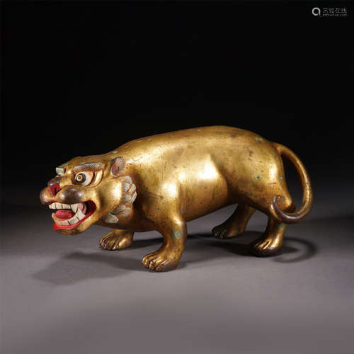 A GILT BRONZE AUSPICIOUS BEAST